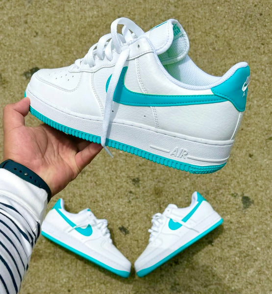 white nike shoes with teal swoosh