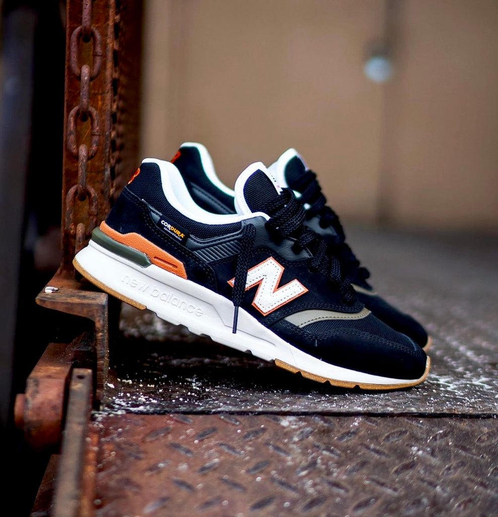 NEW BALANCE TRAINERS BLACK WHITE ORANGE GUM BOTTOM